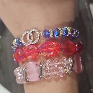 3 different bracelets different colors with blingy red, blue, pink